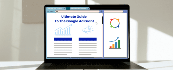 Open laptop displaying 'Ultimate Guide To The Google Ad Grant' with charts and icons on a white desk in sunlight.